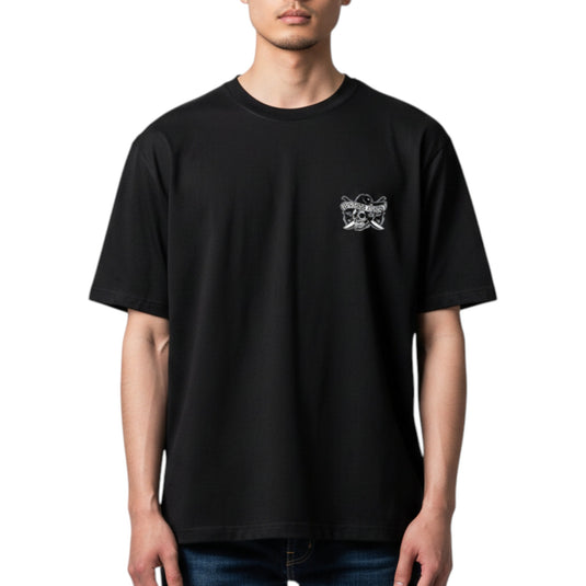 Person wearing a black t-shirt with a small graphic on the chest against a white background