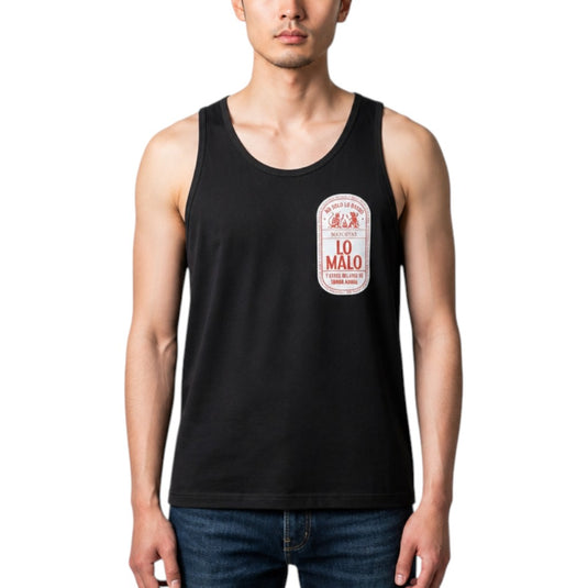 A man wearing a black sleeveless tank top with a vintage-style 'Lo Malo' beer label graphic on the left chest, paired with blue jeans, against a plain white background.
