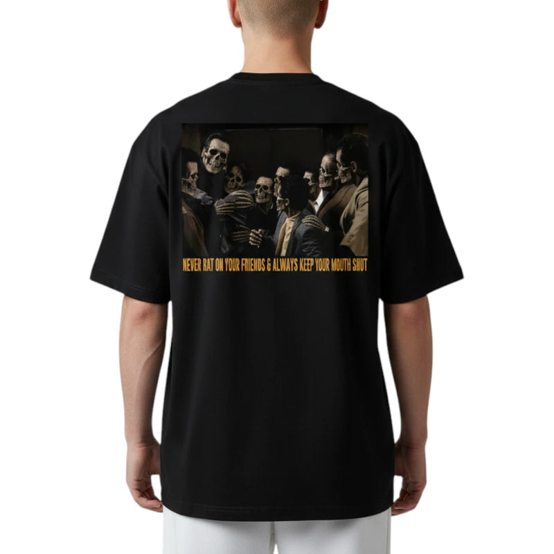 Load image into Gallery viewer, A person shown from the back wearing a black short-sleeve T-shirt with a large rectangular graphic print on the back. The graphic depicts several figures in dark clothing and includes yellow text near the bottom.
