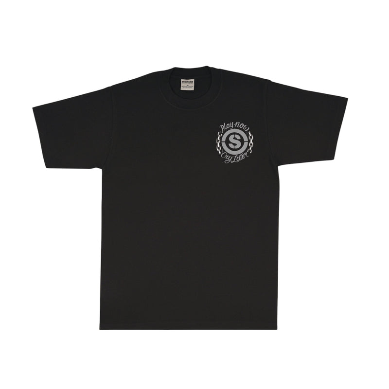 Load image into Gallery viewer, Black t-shirt with a circular 'S' logo and 'Play Now Cry Later' printed on the left chest. 
