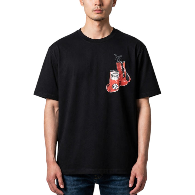 Load image into Gallery viewer, A man wearing a black short-sleeve t-shirt with a red and white graphic of boxing gloves, paired with blue jeans, against a plain white background.
