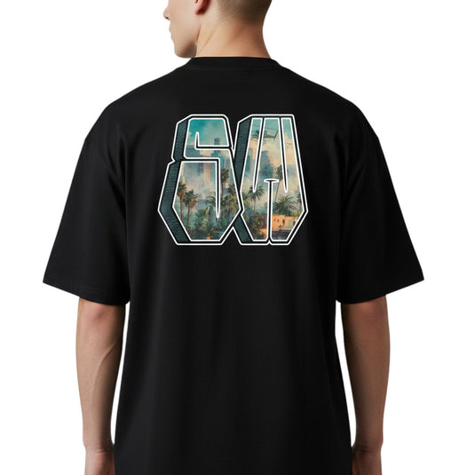 Black t-shirt with a scenic design on the back, worn by a person.