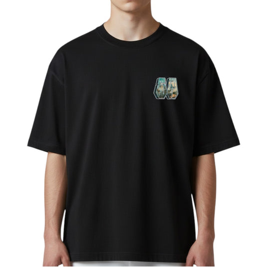 Black t-shirt with a small graphic on the chest worn by a person