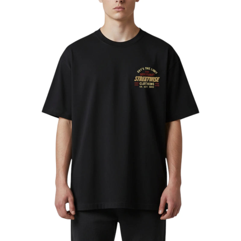 Load image into Gallery viewer, A man wearing an oversized black t-shirt with a vintage-style graphic on the left chest that reads 'STREETWISE CLOTHING EST. 1995' in yellow and red, set against a plain white background.
