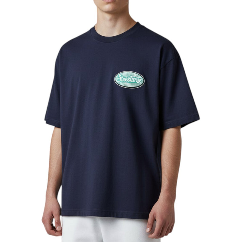 Load image into Gallery viewer, Person wearing a navy blue t-shirt with a logo on a white background
