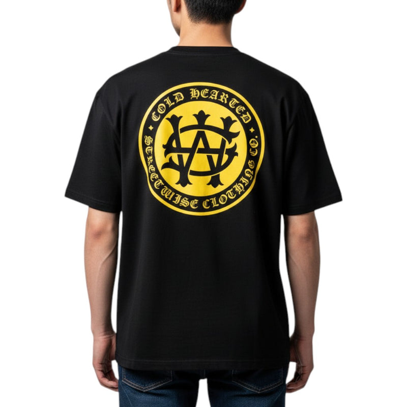 Load image into Gallery viewer, Black t-shirt with yellow logo on the back worn by a person, on a white background
