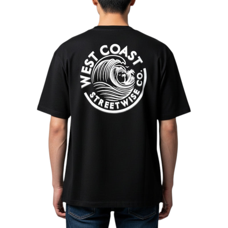 Load image into Gallery viewer, Black t-shirt with 'West Coast Streetwise Co' logo on the back, worn by a person.

