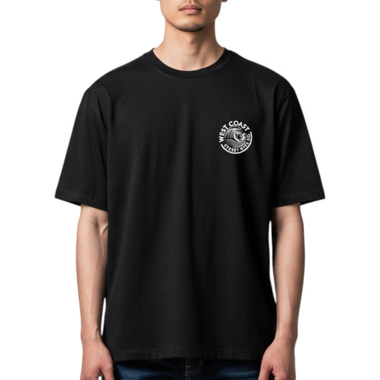 Person wearing a black t-shirt with a logo on the chest against a white background