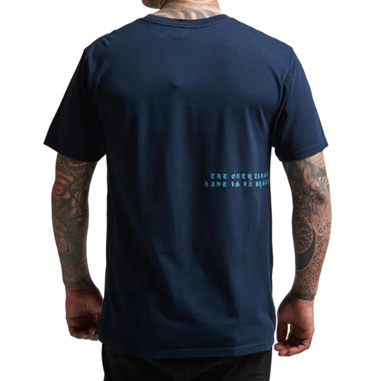 Navy blue t-shirt with text on the back worn by a person with tattoos.