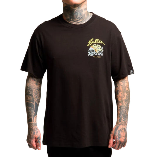 Person wearing a black t-shirt with a logo on a plain background