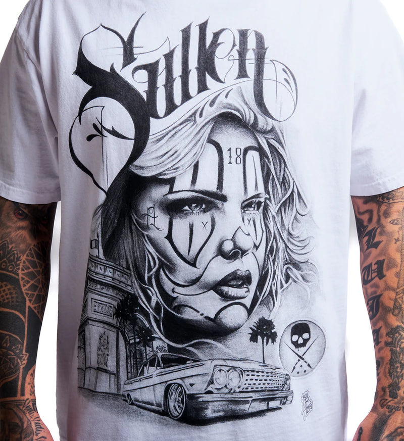 Load image into Gallery viewer, A close-up of a white short-sleeve t-shirt featuring a large black and gray graphic print of a stylized woman's face, the word 'Sullen' in gothic lettering, a classic car, and other street-art elements. The shirt is shown on a model with tattooed arms.
