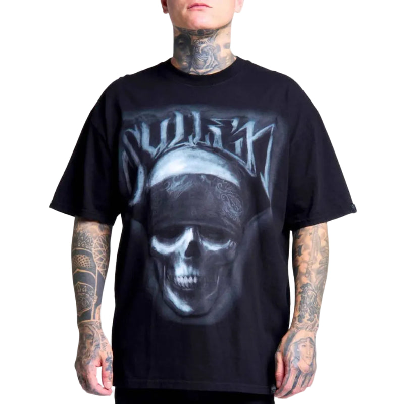 Load image into Gallery viewer, A man wearing a black t-shirt with a large graphic print of a skull wearing a bandana and the word 'Sullen' in stylized lettering, shown against a plain white background.
