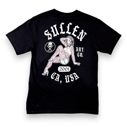 Person wearing a black t-shirt with a 'Sullen' logo and a Pin-Up Girl on a white background