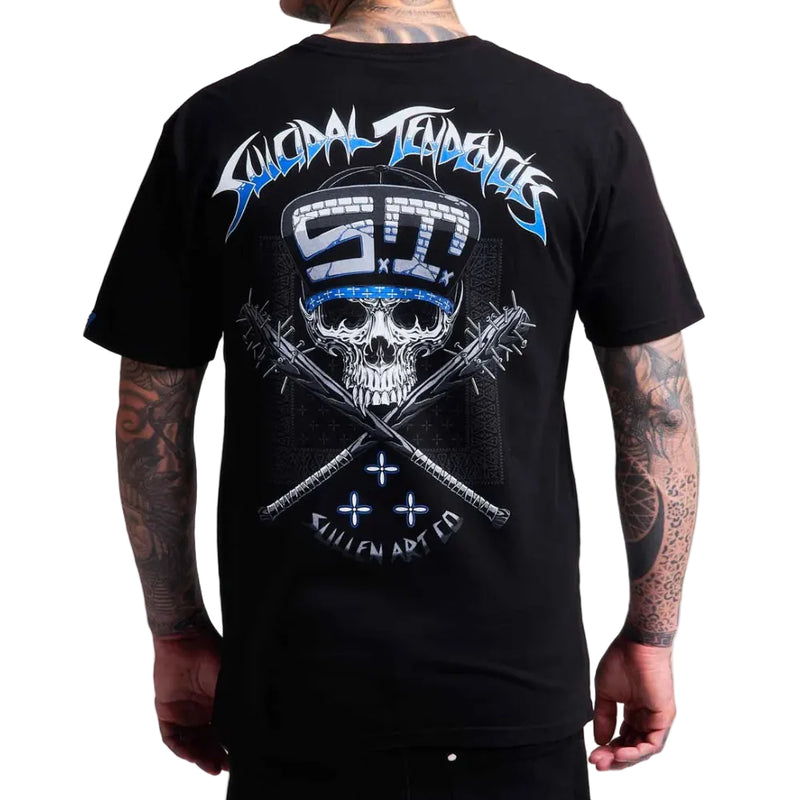 Load image into Gallery viewer, A man wearing a black t-shirt, viewed from the back. The shirt features a large graphic print of a skull wearing a blue and white striped hard hat, with crossed chains and the text 'Suicidal Tendencies' and 'SULLEN ART CO' in blue and white.
