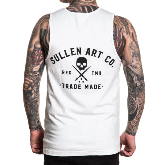 Person wearing a white sleeveless shirt with 'Sullen Art Co.' logo and tattoos on arms