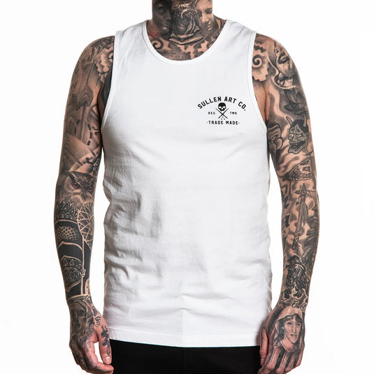 Person wearing a white sleeveless shirt with 'Sullen Art Co.' logo and tattoos on arms