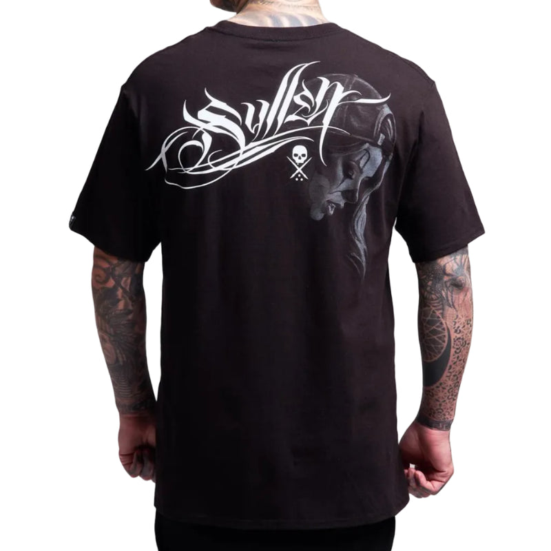 Load image into Gallery viewer, A man wearing a black t-shirt, viewed from the back. The shirt features a large white graphic with stylized text and a skull logo, alongside a dark gray illustration of a woman's profile.
