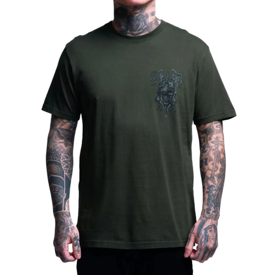 Person wearing a green t-shirt with a graphic design on a white background