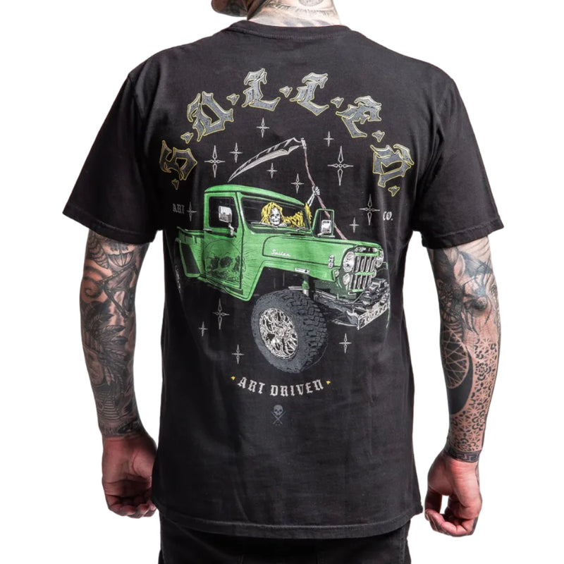 Load image into Gallery viewer, Black t-shirt with a green truck graphic on the back, worn by a person with tattoos.
