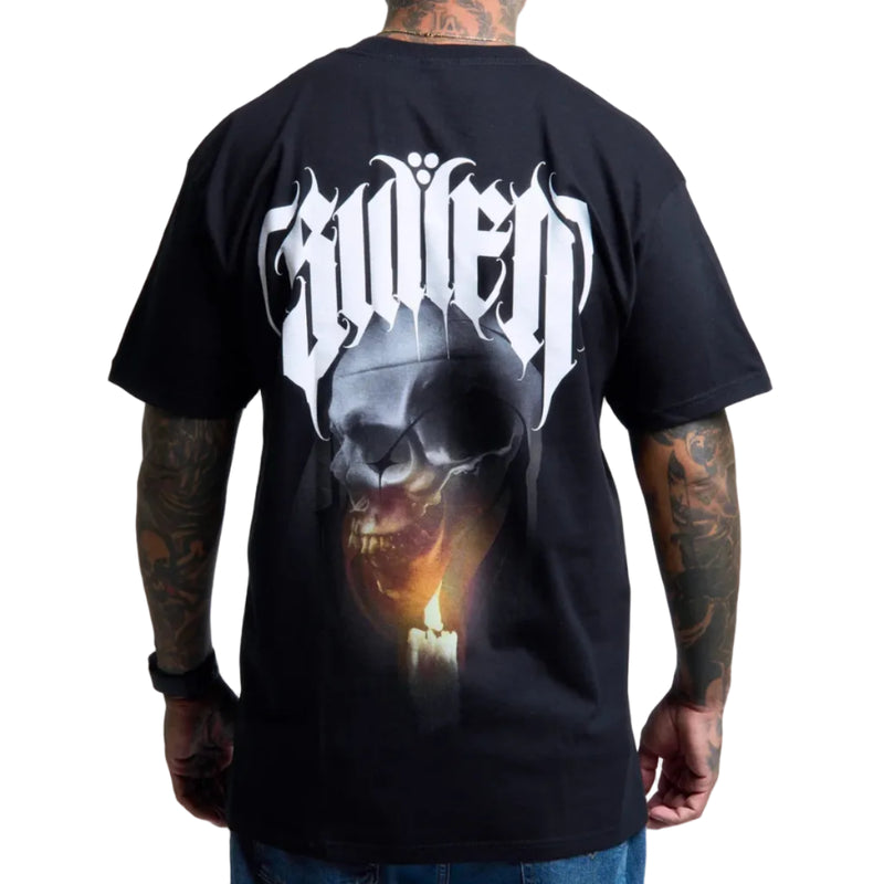 Load image into Gallery viewer, A man wearing a black t-shirt, viewed from the back. The shirt features a large graphic print with the band name 'Sullen' in a stylized white font above a dark skull and a glowing candle.
