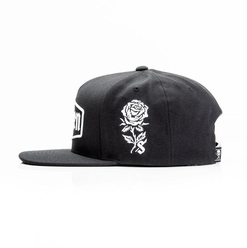 Load image into Gallery viewer, Sullen Black cap with an embroidered white rose design on a white background
