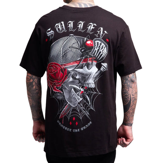 Black t-shirt with a skull and rose design on the back, worn by a person.