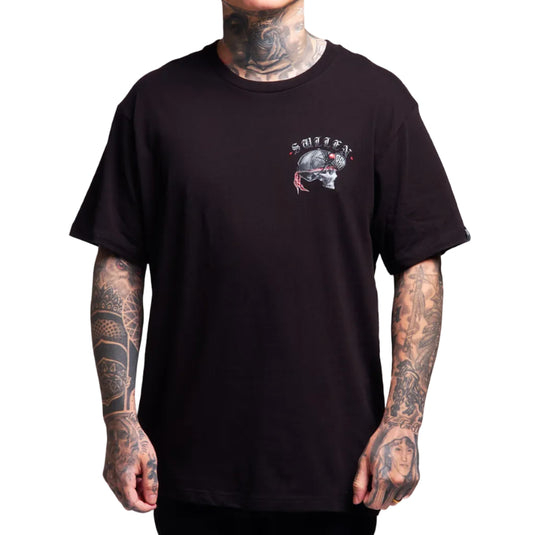 Person wearing a black t-shirt with a graphic design on a white background
