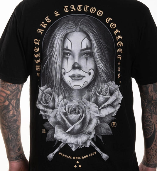 Black t-shirt with a graphic design of a woman with clown makeup and roses, featuring the text 'Sullen Art & Tattoo Collection'.