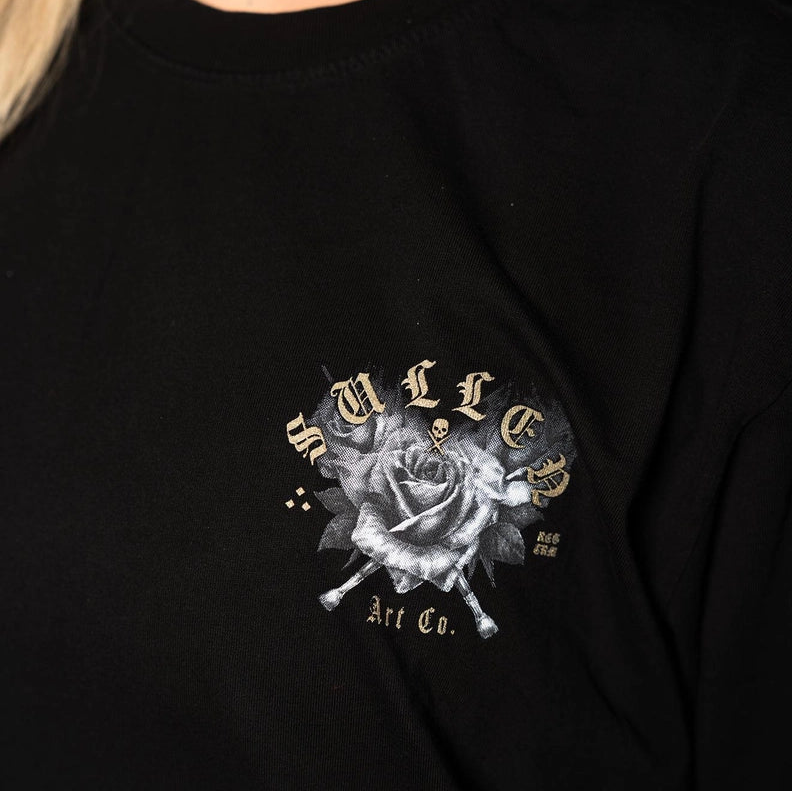 Load image into Gallery viewer, Close-up of a person wearing a black crewneck sweatshirt with a graphic on the chest featuring a grayscale rose and the text 'SULLEN Art Co.' in a stylized font.
