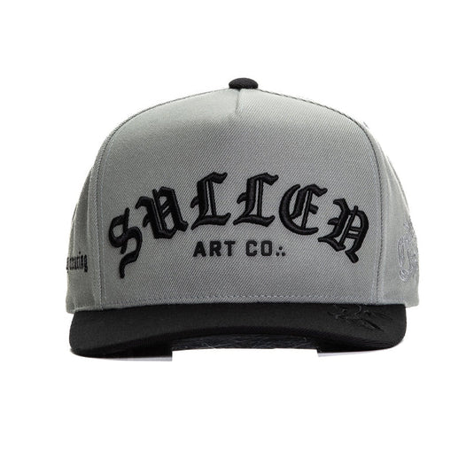 Gray cap with black logo and text on a white background