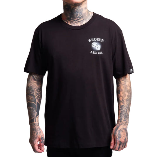 Person wearing a black t-shirt with a logo on a gray background