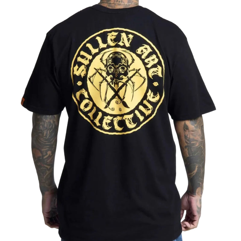 Load image into Gallery viewer, A man wearing a black t-shirt, viewed from the back. The shirt features a large circular graphic print in gold and yellow, depicting a skull with crossed tools and the text 'Sullen Art Collective'.
