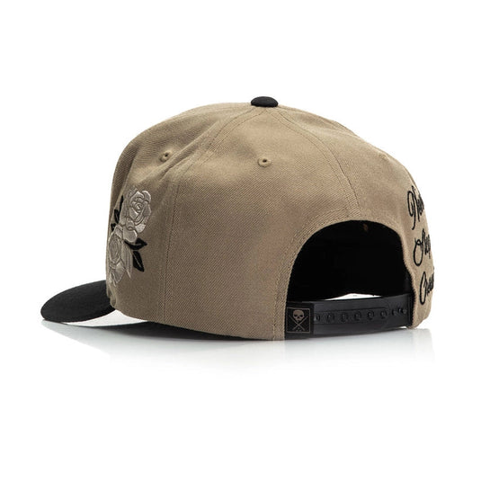 Beige cap with black rose design and text on a white background