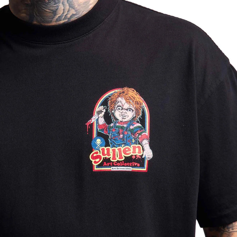 Load image into Gallery viewer, A close-up of a black t-shirt featuring a graphic print of Chucky from the movie 'Sullen Art Collective' on the chest. The graphic shows Chucky holding a knife with the text 'suffering art collective' in red and white.
