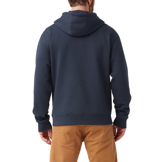 Back of model wearing a dark navy men's Dickies fleece pullover hoodie with the iconic tri-color classic horseshoe logo on the front center chest.