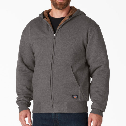 Man wearing a gray hoodie with a white background