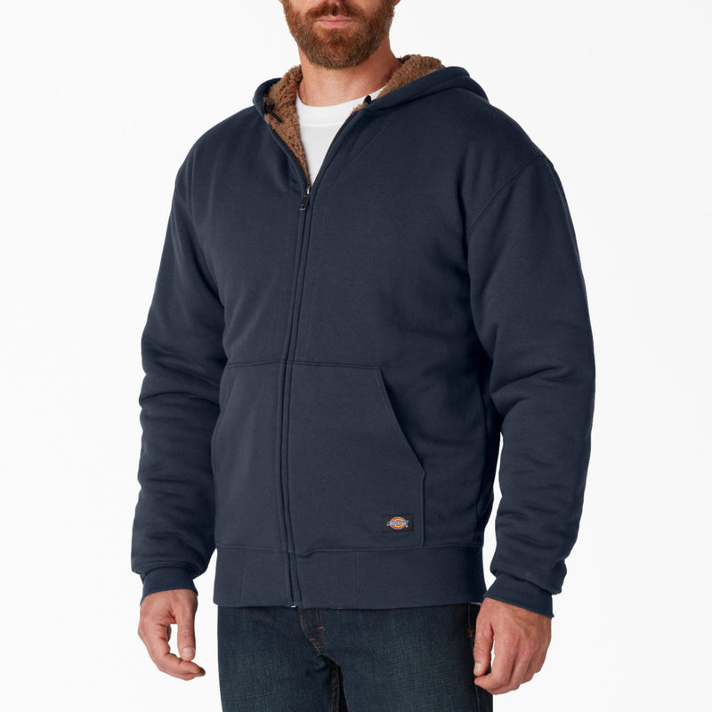 Load image into Gallery viewer, Man wearing a navy blue hoodie with brown lining on a white background
