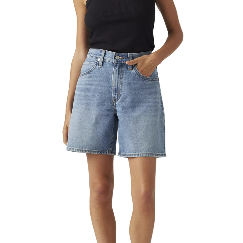 Load image into Gallery viewer, Woman wearing a black tank top and light blue denim shorts on a white background
