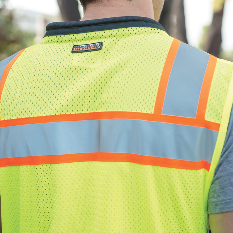 Load image into Gallery viewer, Kishigo S5002 Black Series Surveyor's Vest is a premium solid front with heavy duty bottom and mesh back. The photo is the back of a person wearing the lime safety vest. 
